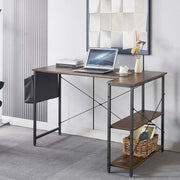 Reversible L-Shaped Computer Desk with laptop and decor showcasing its stylish and organized design in a modern office space.