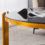 Round Glass Coffee Table with gold geometric frame and black tempered glass surface, perfect for modern decor.