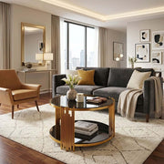 Round Glass Coffee Table in a modern living room with clean lines and a gold geometric frame.
