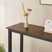 Console Table showcasing a rustic design with a vase of dried flowers on top.