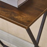 Close-up of the wooden surface of a rustic folding TV tray table with a sleek design and minimal assembly required.