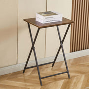 Rustic folding TV tray table with books on top, perfect for maximizing space and easy storage.