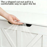 Person using the u-shaped cut-out pull on a Rustic Wooden Storage bench lid for easy access.