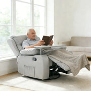 Senior man enjoying a book in a Swivel Rocker Recliner with a tray table, providing ultimate comfort and relaxation.