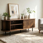 Tambour door TV stand styled in a modern living room media console setup