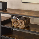 TV Stand with Charging Station showcasing a woven basket on shelves with books and a compact speaker.